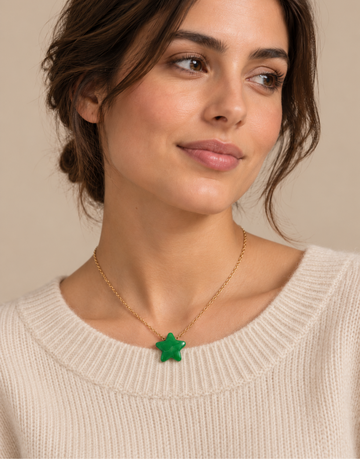 Woman wearing a green Tagua star pendant necklace on a fine gold-tone chain